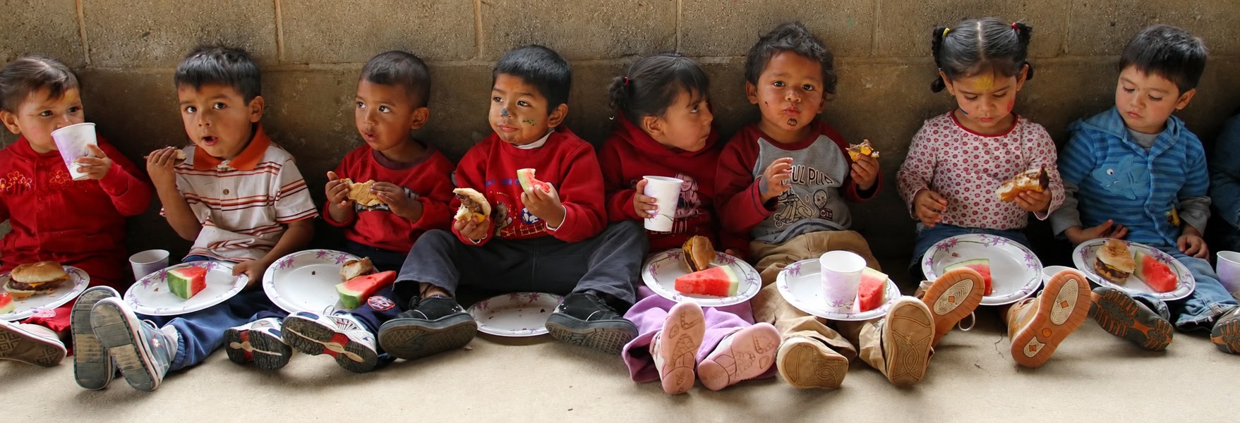 Children sharing a meal at H.I.S. Ministries